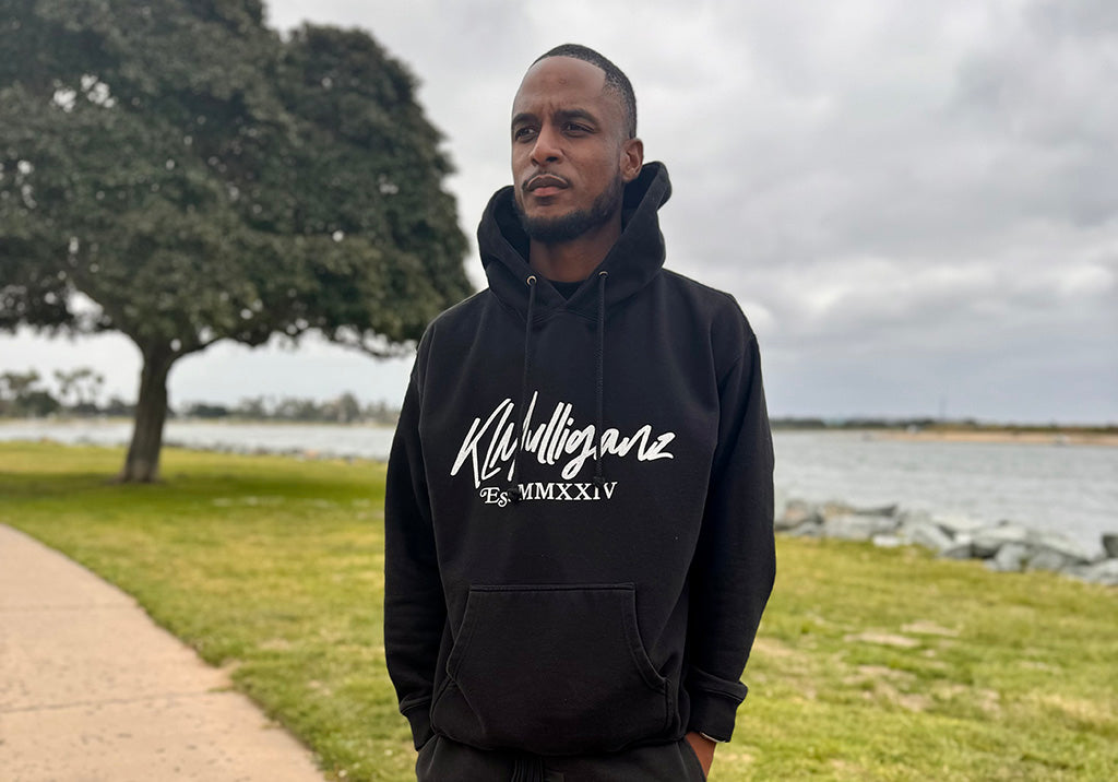 Man wearing KLMulliganz lifestyle hoodie, featuring premium golf apparel designed for both on and off the course. Stylish and comfortable, perfect for casual outings and active days.